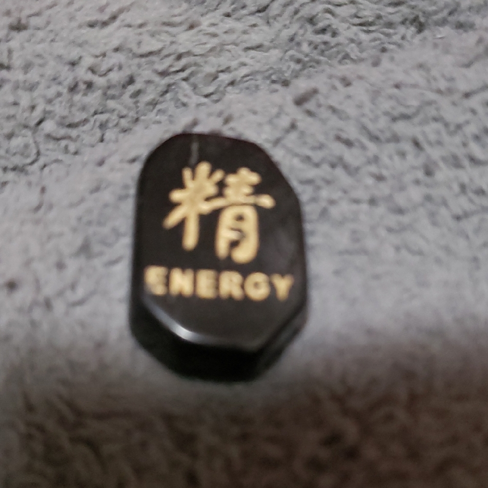 Black Energy Stone with Gold Lettering
